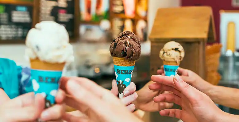 3 hands passing ice cream cones